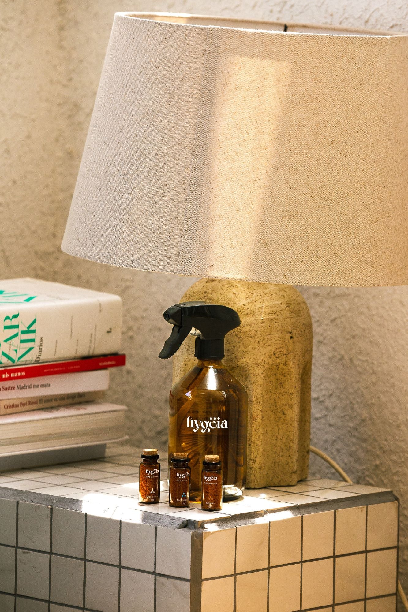 eco friendly cleaning products next to a lampshade in home environment 