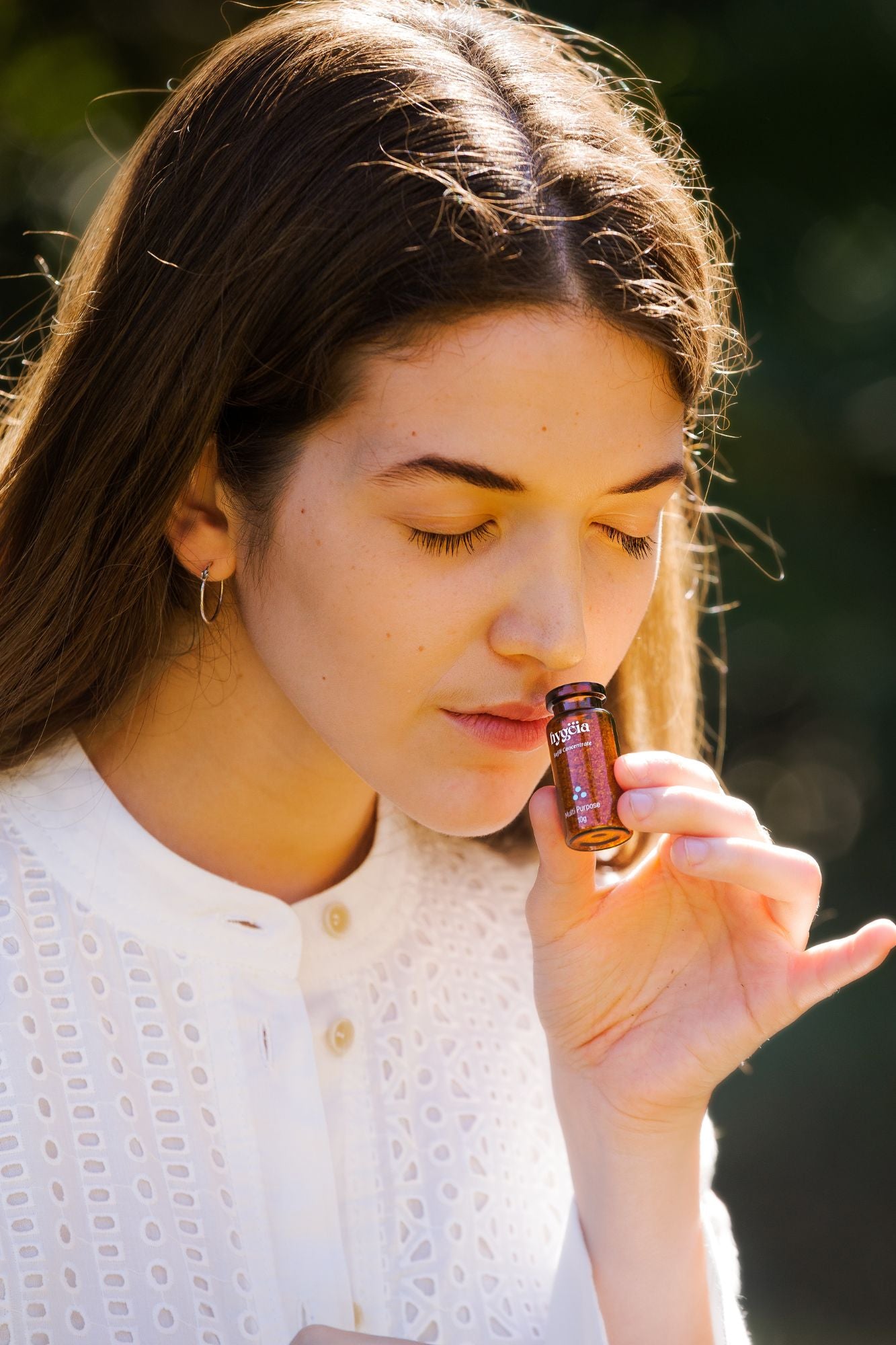 girl smelling refillable cleaning powder